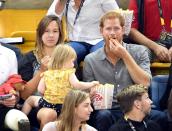 However when he wasn't looking she sneakily grabbed some popcorn for herself.