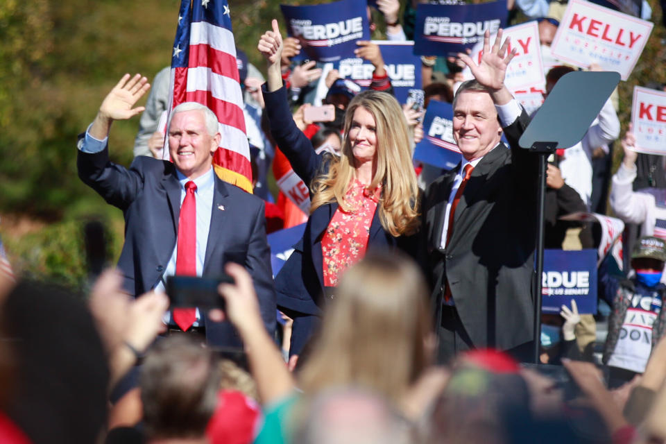 Vice President Mike Pence (from left) and Sens. Kelly Loeffler and David Perdue wave to supporters at a Defend the Majority Rally in Canton, Georgia, Friday. (Photo: Jason Armond via Getty Images)