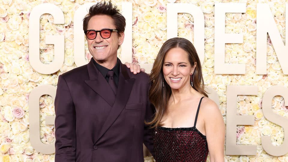 Actor Robert Downey Jr. was looking at the world through rose-tinted glasses as he and wife Susan Downey wore complementary ensembles by Dior. - Monica Schipper/GA/The Hollywood Reporter/Getty Images