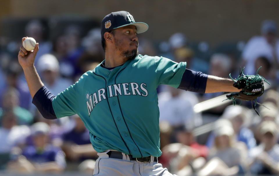 Seattle Mariners starting pitcher Yovani Gallardo throws against the Seattle Mariners during first inning at a spring baseball game in Scottsdale, Ariz., Saturday, March 4, 2017. (AP Photo/Chris Carlson)