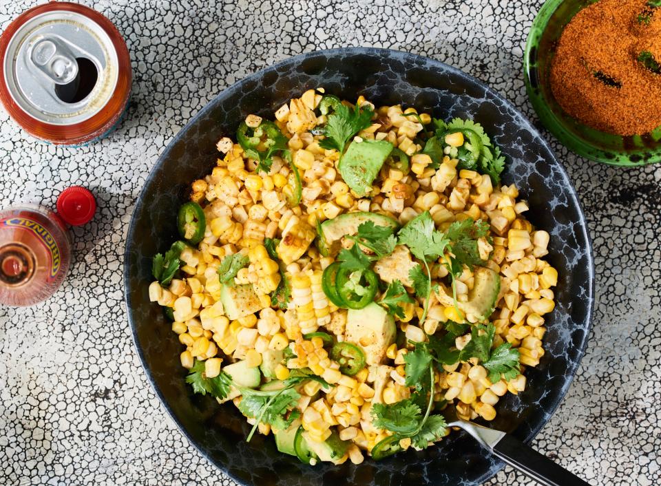 Bright and light, this grilled corn salad with avocado will go with everything else at your summer barbecue. Hot honey might sound heavy, but it's anything but when paired with tender cilantro and plenty of lime. This recipe is from <a rel="nofollow noopener" href="https://www.bscracklinbbq.com/" target="_blank" data-ylk="slk:B’s Cracklin’ BBQ;elm:context_link;itc:0;sec:content-canvas" class="link ">B’s Cracklin’ BBQ</a> in Savannah, GA. Picnic season can't come soon enough! <a rel="nofollow noopener" href="https://www.bonappetit.com/recipe/grilled-corn-salad-with-hot-honey-lime-dressing?mbid=synd_yahoo_rss" target="_blank" data-ylk="slk:See recipe.;elm:context_link;itc:0;sec:content-canvas" class="link ">See recipe.</a>