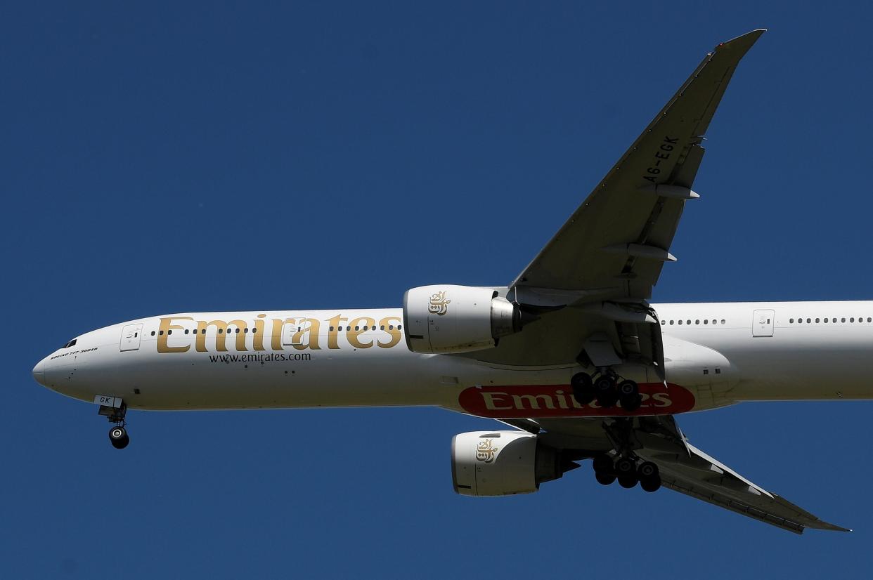 FILE PHOTO: An Emirates passenger plane comes in to land at Heathrow airport during the coronavirus pandemic, London, Britain, May 21, 2020. REUTERS/Toby Melville 