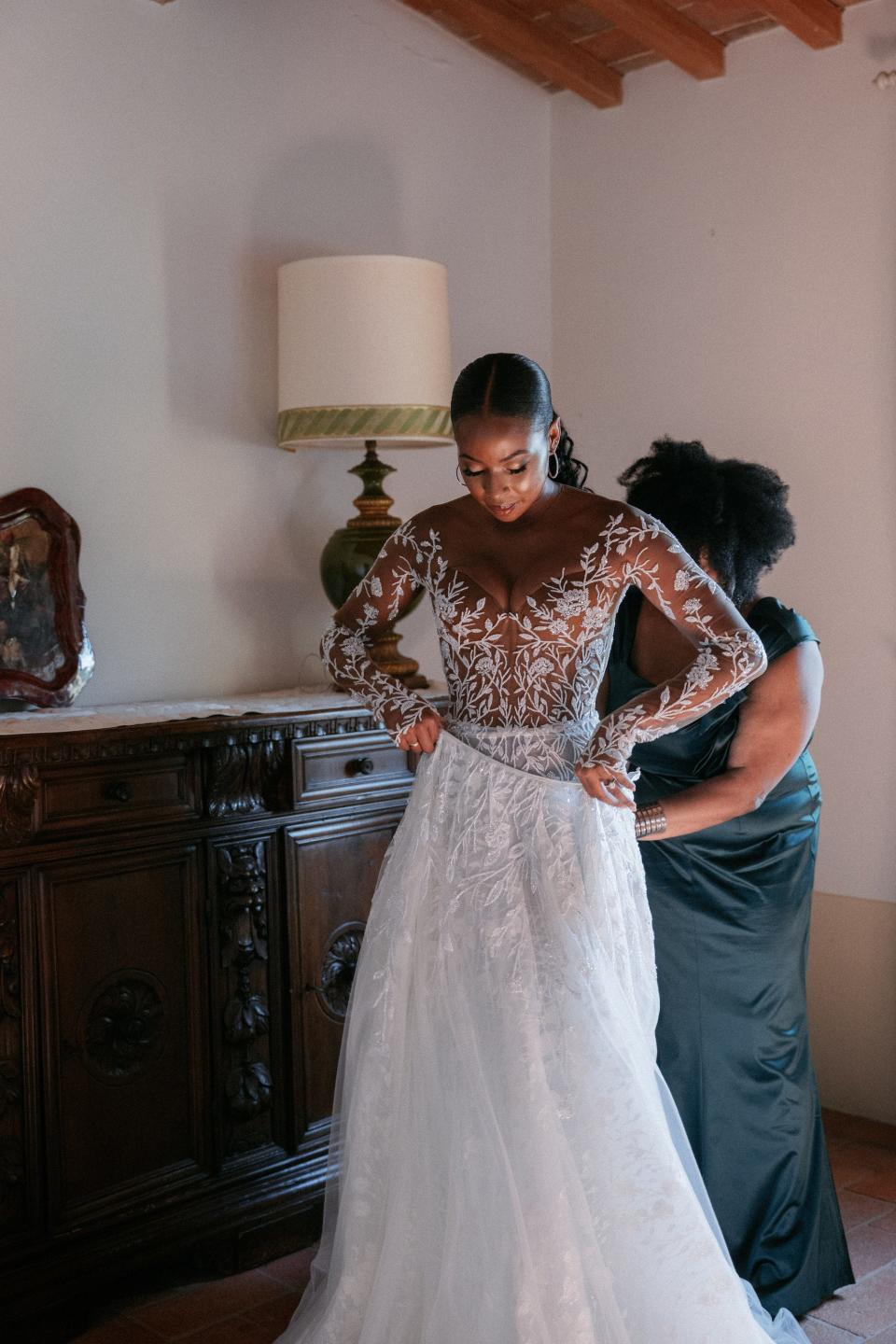 A bride pulls on her skirt on her wedding day.