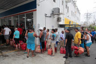 <p>People line up to buy gasoline at a gas station after the area was hit by Hurricane Maria, in San Juan, Puerto Rico, Sept. 22, 2017. (Photo: Alvin Baez/Reuters) </p>