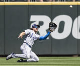 Tampa Bay Rays centerfielder Brett Phillips slides as he makes a catch for an out on a a ball hit by Seattle Mariners' Ty France during the fourth inning of a baseball game, Sunday, June 20, 2021, in Seattle. (AP Photo/Stephen Brashear)