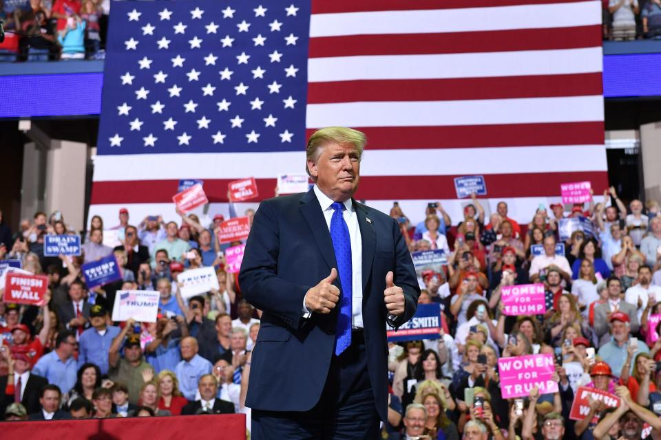 At a campaign rally in Mississippi, President Donald Trump mocked Christine Blasey Ford's emotional testimony and his supporters laughed. (MANDEL NGAN via Getty Images)