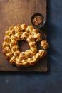 <p>You can't go wrong with cocktail sausages in crescent roll dough.</p><p>Get the <a href="https://www.goodhousekeeping.com/food-recipes/a11579/easy-pigs-in-a-blanket-recipe-122799/" rel="nofollow noopener" target="_blank" data-ylk="slk:Pull-Apart Pigs in Blankets recipe;elm:context_link;itc:0;sec:content-canvas" class="link "><strong>Pull-Apart Pigs in Blankets recipe</strong></a>.</p>