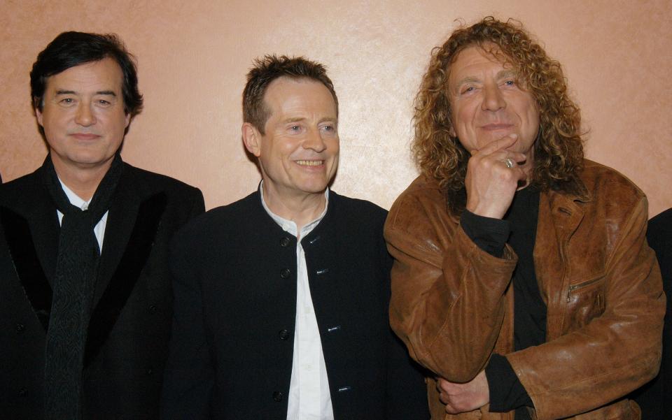 UNITED STATES - MAY 27:  Guitarist Jimmy Page, bassist and keyboard player John Paul Jones and vocalist Robert Plant (l. to r.) arrive for a screening of 