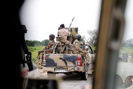 A Nigerian army convoy vehicle drives ahead with an anti-aircraft gun, on its way to Bama, Borno State, Nigeria August 31, 2016. REUTERS/Afolabi Sotunde