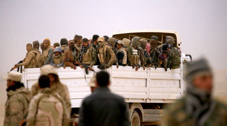 Members of the Lions of the Tigris, a group of Sunni Arab fighters and part of the Hashid Shaabi (Popular Mobilization Comimittee) take part during a military operation against Islamic State militants in Shayyalah al-Imam, Iraq November 30, 2016. REUTERS/Thaier Al-Sudani