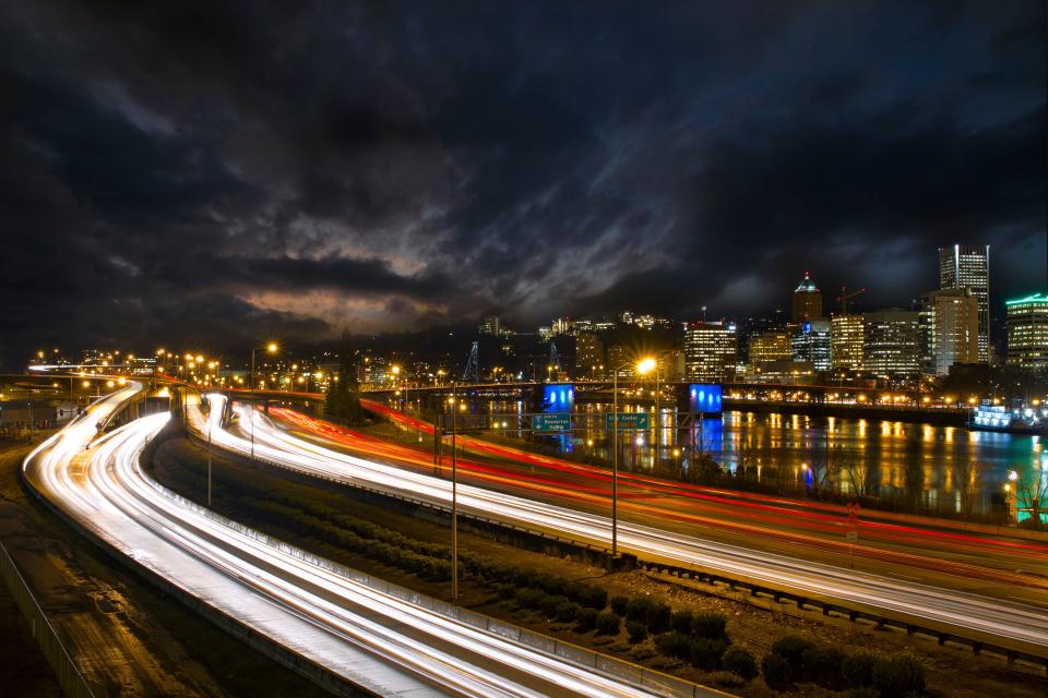 Headlights and taillights illuminate a downtown Portland, Oregon freeway pictured in this undated photo. | David Gn, Adobe.com