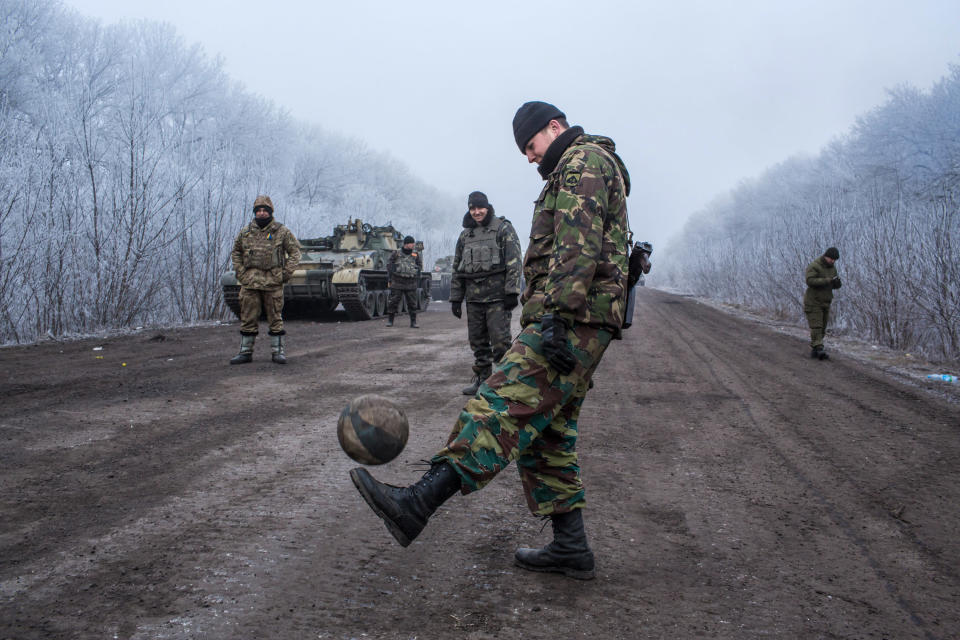 Ukrainian soldiers play football on a&nbsp;road leading to the embattled town of Debaltseve on Feb. 15. Tensions between Ukraine and Russia <a href="http://www.huffingtonpost.com/news/ukraine-war/">continued to mount</a>&nbsp;after fighting broke out between the Ukrainian army and Russian-backed separatists in the country's east. Some <a href="http://www.dw.com/en/ukraine-conflict-death-toll-nears-8000-un/a-18701777">8,000 people</a>&nbsp;have been killed in the conflict.&nbsp;