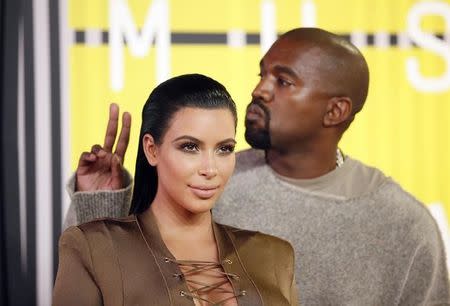 TV personality Kim Kardashian and musician Kanye West arrive at the 2015 MTV Video Music Awards in Los Angeles, California, August 30, 2015. REUTERS/Danny Moloshok