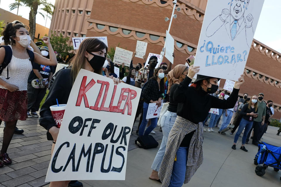 Students for Socialism protest on campus demanding that Kyle Rittenhouse not be allowed to enroll at Arizona State University, Wednesday, Dec. 1, 2021, at ASU in Tempe, Ariz. Protesters were demanding the university disavow the 18-year-old, who was acquitted of murder last month in the deadly shootings during last year's unrest in Kenosha. (AP Photo/Matt York)