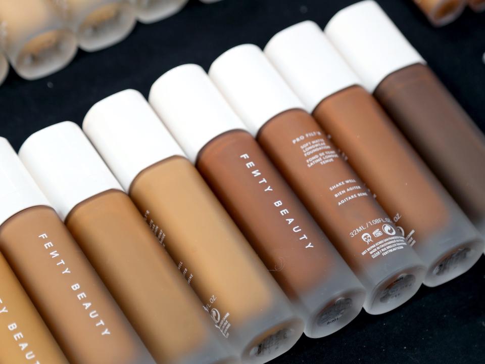 A row of Fenty Beauty products in a variety of shades