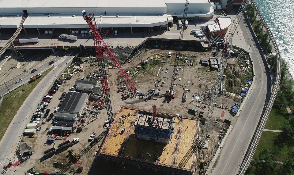 Cranes stand over the construction site at the former Joe Louis Arena near the riverfront in Detroit on July 21, 2022.