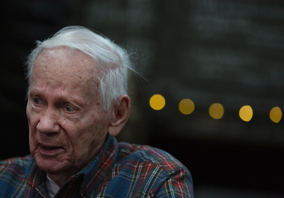 In this Tuesday, Dec. 10, 2019 photo, World War II and Battle of the Bulge veteran Arthur Jacobson, from Port St. Lucie, Florida, speaks with a journalist during an interview with the The Associated Press at the Remember Museum 39-45 in Thimister-Clermont, Belgium. It was 75 years ago that Hitler launched his last desperate attack to turn the tide for Germany in World War II. At first, German forces drove so deep through the front line in Belgium and Luxembourg that the month-long fighting came to be known as The Battle of the Bulge. (AP Photo/Virginia Mayo)