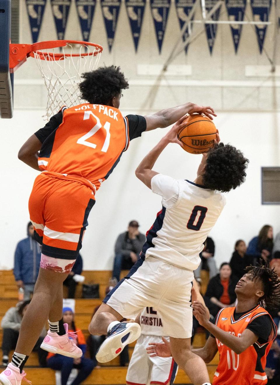 Cosumnes Oaks’ Henry Hill blocks Modesto Christian’s Myles Jones during the Sac-Joaquin Section Division I playoff game at Modesto Christian High School in Salida, Calif., Wednesday, Feb. 14, 2024.