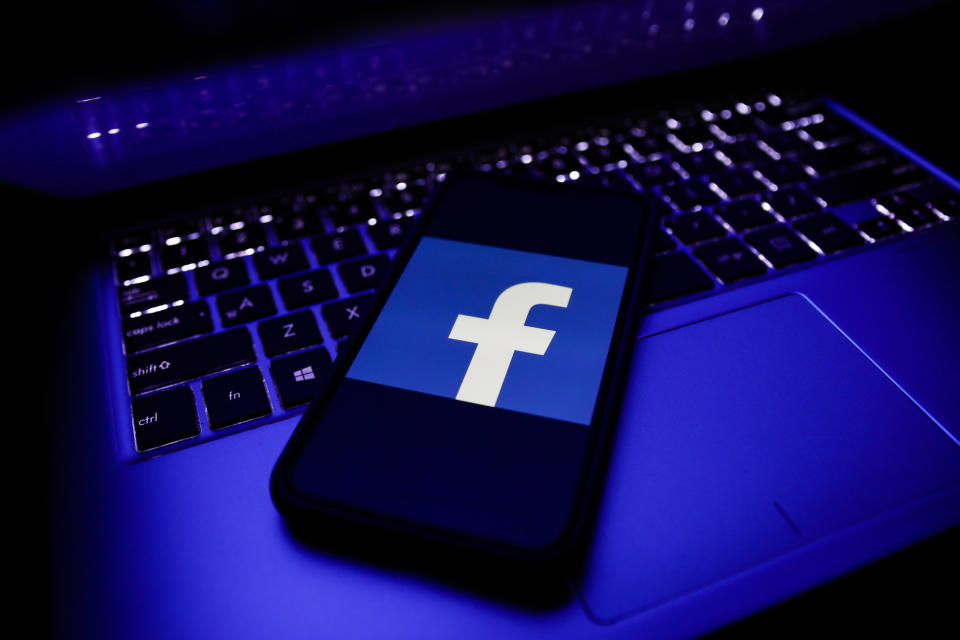 Facebook logo is seen displayed on a phone screen in this illustration photo taken in Poland on November 29, 2020. (Photo illustration by Jakub Porzycki/NurPhoto via Getty Images)