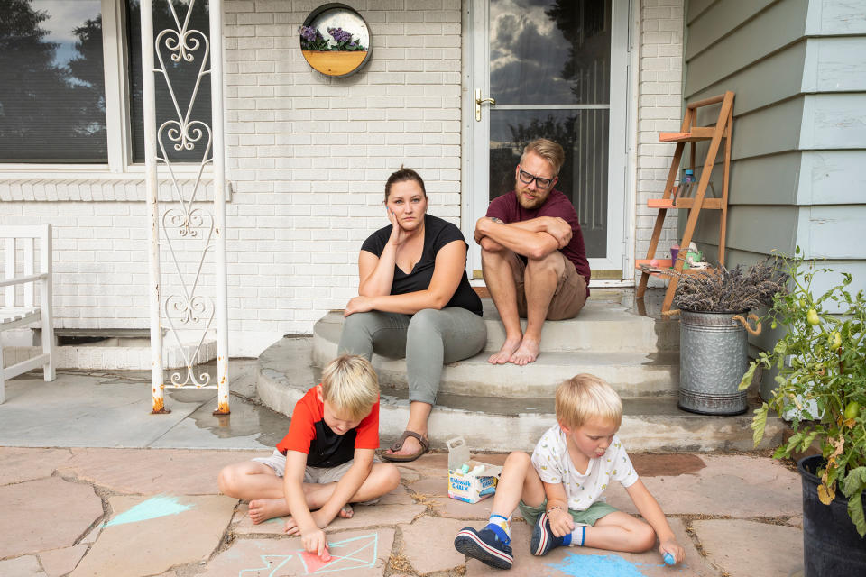 Kayla Brim with her family, outside their home in Caldwell, Idaho, on Aug. 11. Brim has been sick with COVID-19 since early July. | Angie Smith for TIME