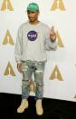 <p>Pharrell rocked up wearing jeans, a Nasa jumper and a cap which had ‘plant’ embroidered on it. Casual. [Photo: Getty] </p>