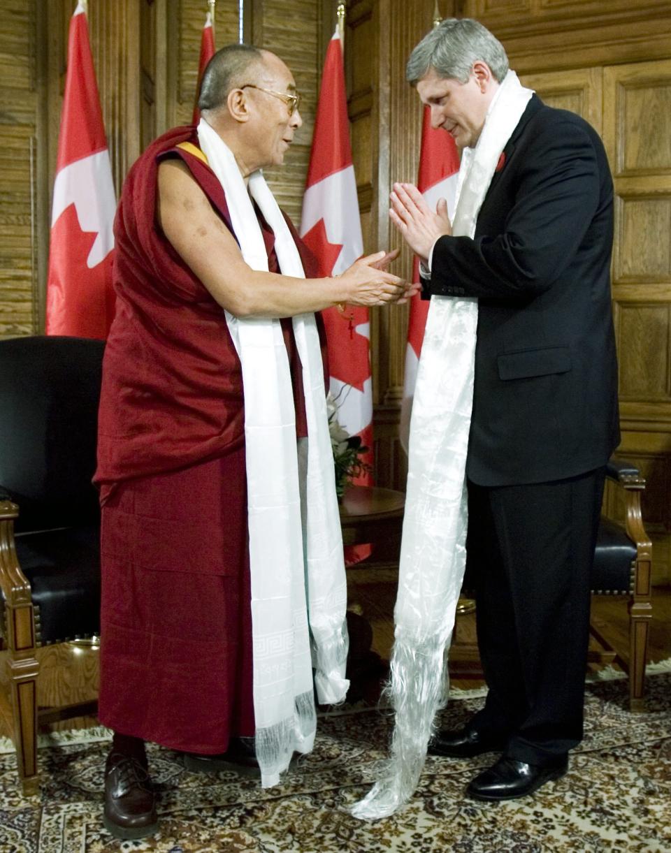 Canadian Prime Minister Stephen Harper thanks the Dalai Lama after exchanging Katas prior to their meeting on Parliament Hill, in Ottawa Monday Oct. 29, 2007. THE CANADIAN PRESS/Tom Hanson