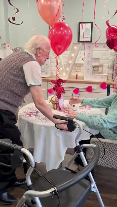 This is the moving moment a devoted wife surprised her dementia-stricken husband by moving into his care home after a month apart - because she 'can't live without him'. Pensioner Kenneth Meredith, 96, walked through the door with his zimmer-frame and broke down in tears when he saw wife Betty Meredith, 91, sitting down in front of him. Seconds later he rushes over to his wife of 71-years, who is seen sitting at a table for a make-shift date night, decorated with heart shaped balloons and roses. With The Platters' 1954 hit 'Only You', playing in the background, the couple share a long hug, after spending five weeks apart. The pair were heartbroken after Kenneth moved into Bourn View Care Home, Birmingham, five weeks ago due to his worsening battle with Alzheimer's. Due to strict rules, he couldn't see wife Betty, who he has been with for 76 years. And with no sign the pandemic was lifting, lonely Betty asked if she could be moved into the care home because she could no longer be apart from her husband. Unbeknown to Kenneth, Betty had moved into the floor below as she waited for her Covid-19 test results - but would continue to phone him for their daily chats. Once her results came back negative, Betty and staff helped arrange the surprise for Kenneth on November 10.