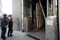 Large artworks are seen in a truck after being removed from Notre-Dame Cathedral to be secured after a massive fire devastated large parts of the gothic cathedral in Paris, Friday, April 19, 2019. Rebuilding Notre Dame, the 800-year-old Paris cathedral devastated by fire this week, will cost billions of dollars as architects, historians and artisans work to preserve the medieval landmark. (Philippe Wojazer/Pool via AP)