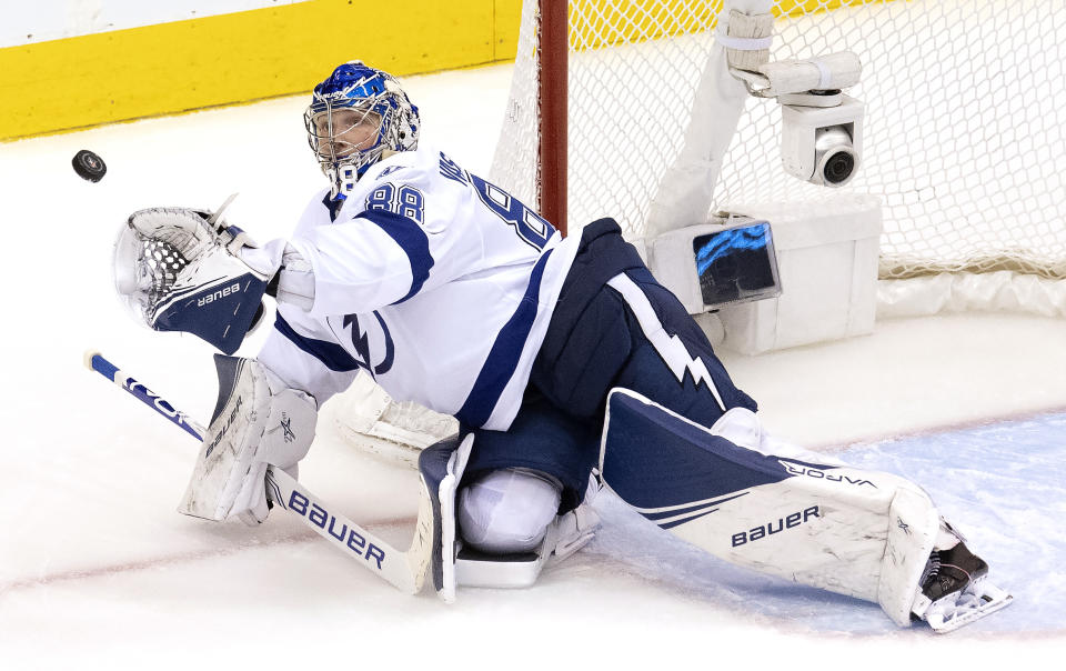 Tampa Bay Lightning goaltender Andrei Vasilevskiy picks the puck out of the air during third period against the Columbus Blue Jackets in Game 4 of an NHL hockey first-round playoff series in Toronto on Monday, Aug. 17, 2020. (Frank Gunn/The Canadian Press via AP)