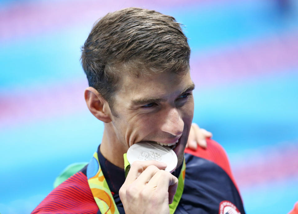 Michael Phelps of Team USA poses with his silver medal in Rio de Janeiro, Brazil, in 2016. (Photo: AI Project / Reuters)