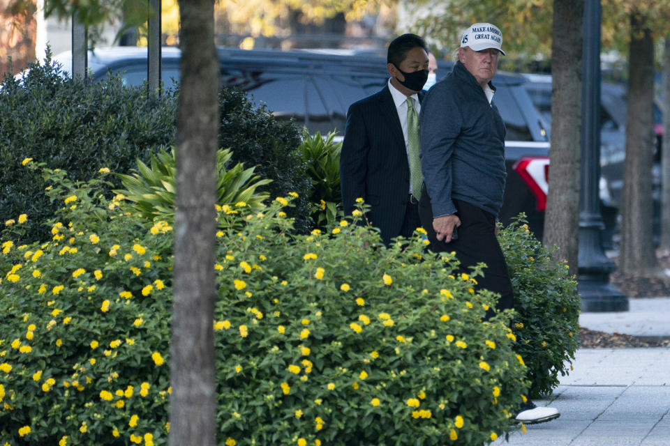 President Donald Trump returns to the White House after playing a round of golf, Saturday, Nov. 7, 2020, in Washington. (AP Photo/Evan Vucci)