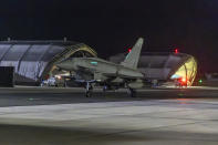 In this image provided on Friday Jan. 12, 2024 by the UK Ministry of Defence an RAF Typhoon aircraft returns to base at RAF Akrotiri in Cyprus, after striking targets in Yemen. The U.S. and British militaries bombed more than a dozen sites used by the Iranian-backed Houthis in Yemen late on Thursday Jan. 11, in a massive retaliatory strike using warship- and submarine-launched Tomahawk missiles and fighter jets, U.S. officials said. (Sgt Lee Goddard, UK Ministry of Defence via AP)