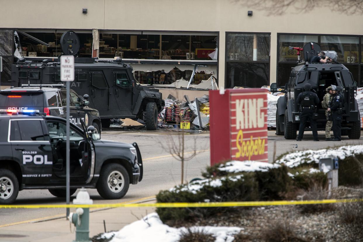 Smashed windows are left at the scene after a gunman opened fire at King Soopers grocery store on March 22, 2021, in Boulder, Colorado. Ten people, including a police officer, were killed in the attack.