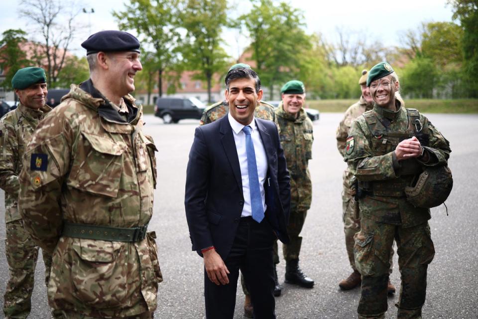 Rishi Sunak speaks with military personnel as he visits the Julius Leber Barracks in Berlin on Wednesday (POOL/AFP/Getty)