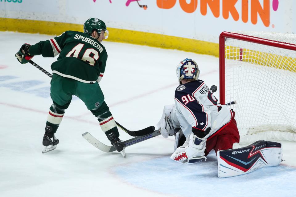 Mar 26, 2022; Saint Paul, Minnesota, USA; Minnesota Wild defenseman Jared Spurgeon (46) scores a goal against Columbus Blue Jackets goaltender Elvis Merzlikins (90) in overtime at Xcel Energy Center. Mandatory Credit: David Berding-USA TODAY Sports