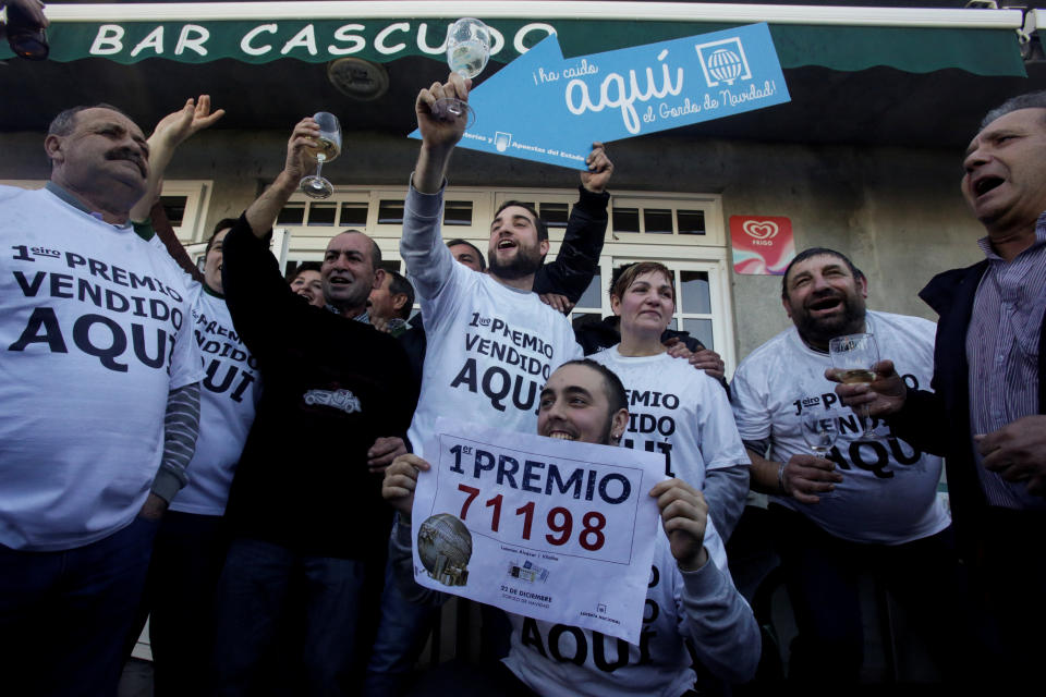 People who bought winning tickets&nbsp;in Spain's Christmas Lottery celebrate in Vilalba&nbsp;on Friday.&nbsp; (Photo: Miguel Vidal / Reuters)