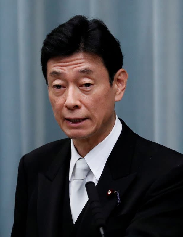 FILE PHOTO: Japan's Economy Minister Nishimura attends a news conference at PM Abe's official residence in Tokyo