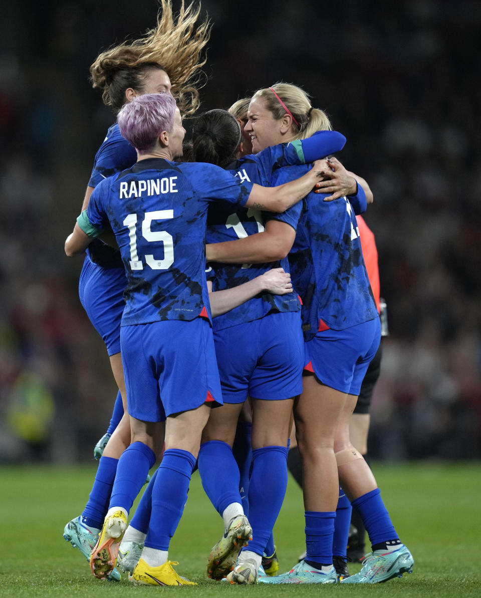 United States' Sophia Smith celebrates with teammates after scoring her side's opening goal during the women's friendly soccer match between England and the US at Wembley stadium in London, Friday, Oct. 7, 2022. (AP Photo/Kirsty Wigglesworth)