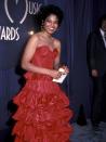 <p>Janet Jackson was radiant at the 10th Annual American Music Awards, where she wore this tiered red strapless gown. </p>