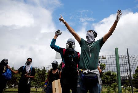 Demonstrators gather in front of an Air Force base while rallying against Venezuelan President Nicolas Maduro's government in Caracas, Venezuela, June 24, 2017. REUTERS/Ivan Alvarado