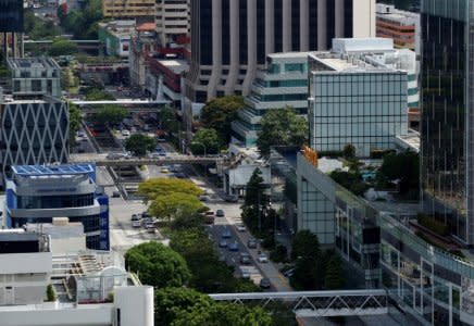 Cars ply the roads in downtown Singapore May 27, 2016. REUTERS/Edgar Su