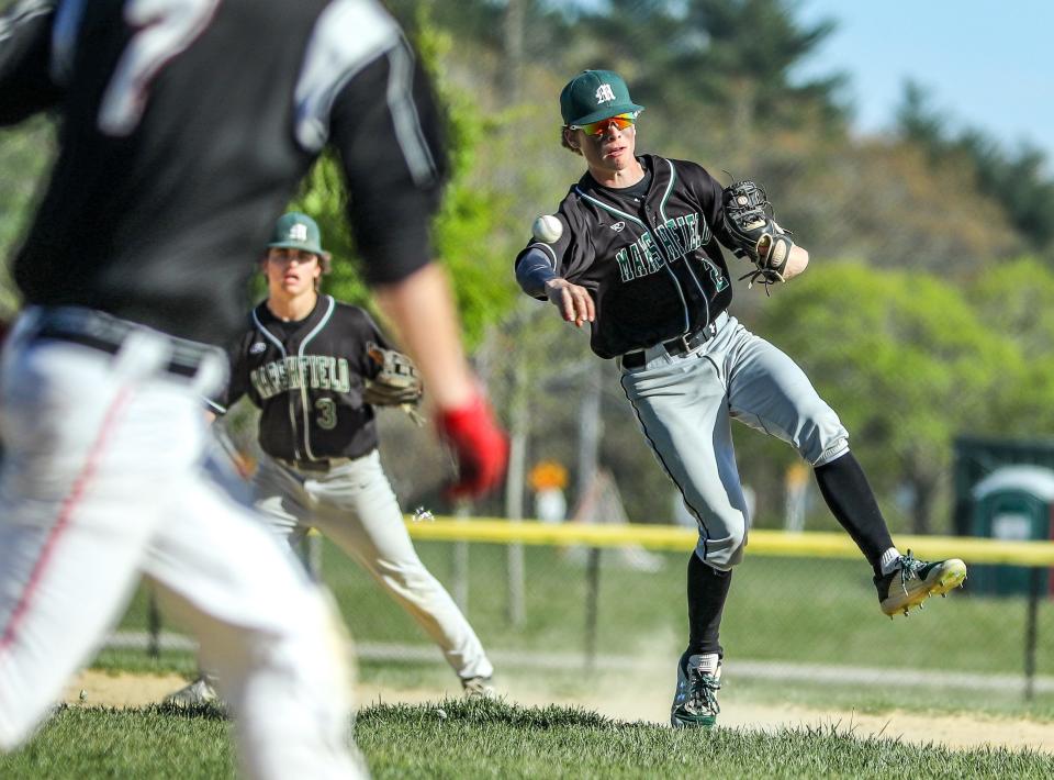 Marshfield's Collin Reilly throws out a runner during a game against Whitman-Hanson on Tuesday, May 10, 2022.