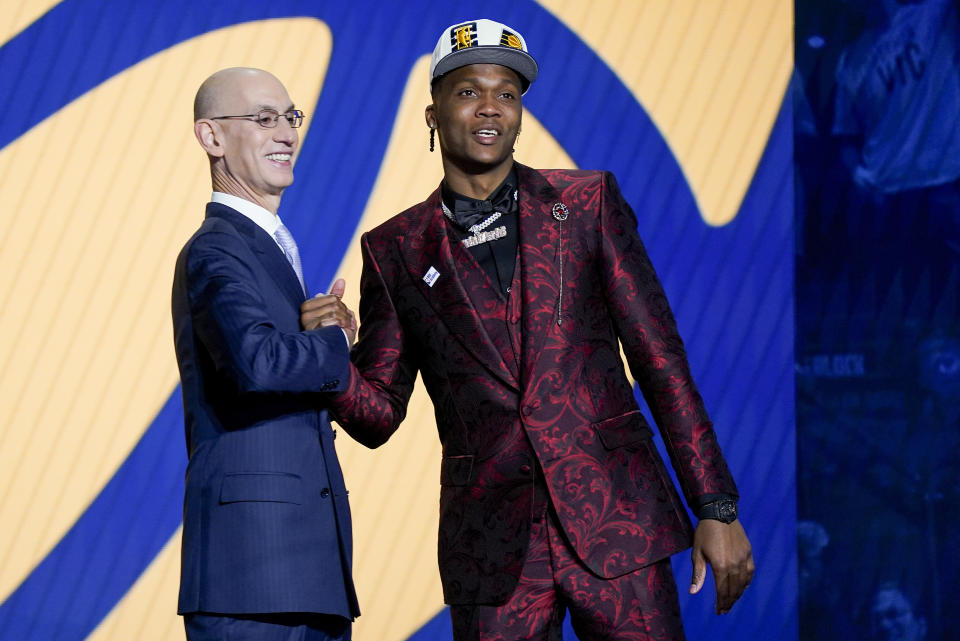 Bennedict Mathurin is congratulated by NBA Commissioner Adam Silver after being selected sixth overall by the Indiana Pacers in the NBA basketball draft, Thursday, June 23, 2022, in New York. (AP Photo/John Minchillo)