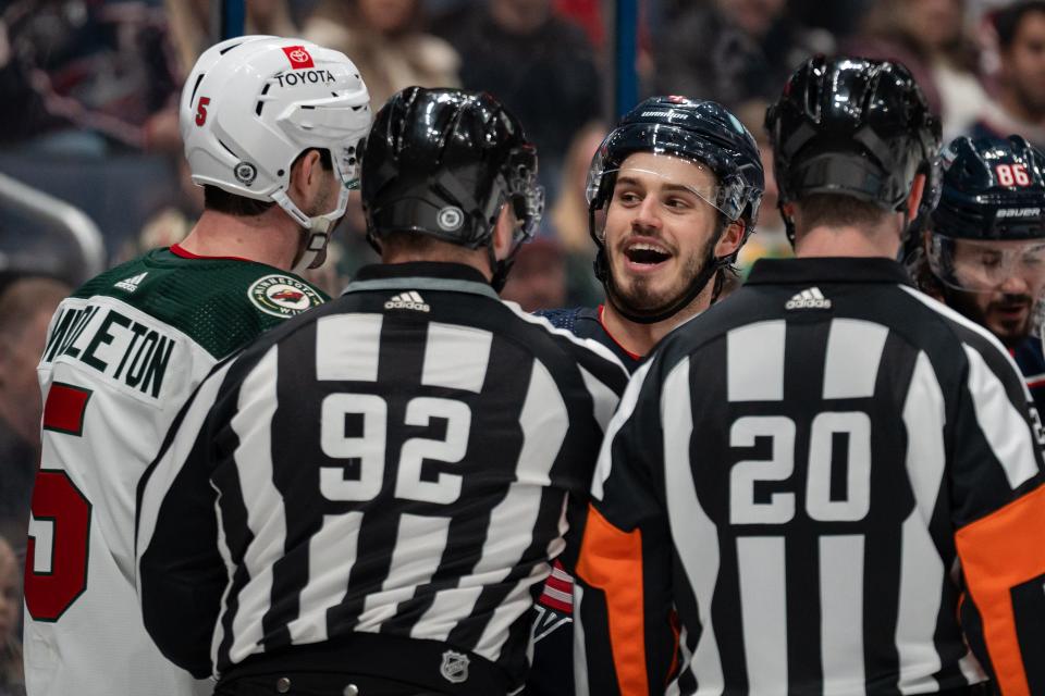 Jan 6, 2024; Columbus, Ohio, USA;
Columbus Blue Jackets center Cole Sillinger (4) talks to Minnesota Wild defenseman Jake Middleton (5) after getting into a fight during the third period of their game on Saturday, Jan. 6, 2024 at Nationwide Arena.