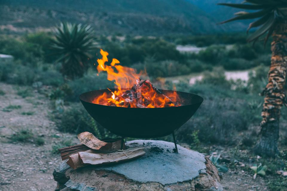 <p>The crisp autumn air, the early nightfall, and the falling leaves make things already feel cozy, so kick it up a level with an outdoor fire pit. A warming, roaring fire helps you extend the outdoor season just a <em>little</em> bit longer. Call your friends, you're throwing a fall bonfire. </p>