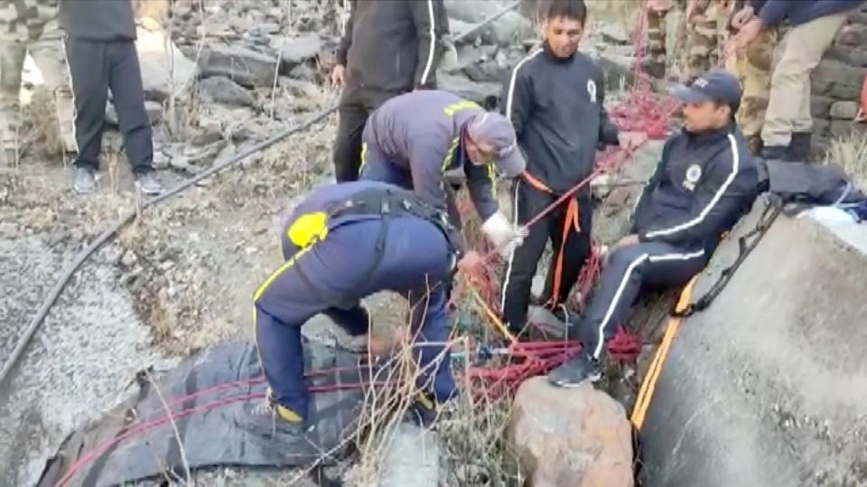 Image: Rescue personnel adjust ropes during rescue operation after a glacier burst, Feb. 7, 2021, in Chamoli, Uttarakhand, India. (State Disaster Force / Reuters)