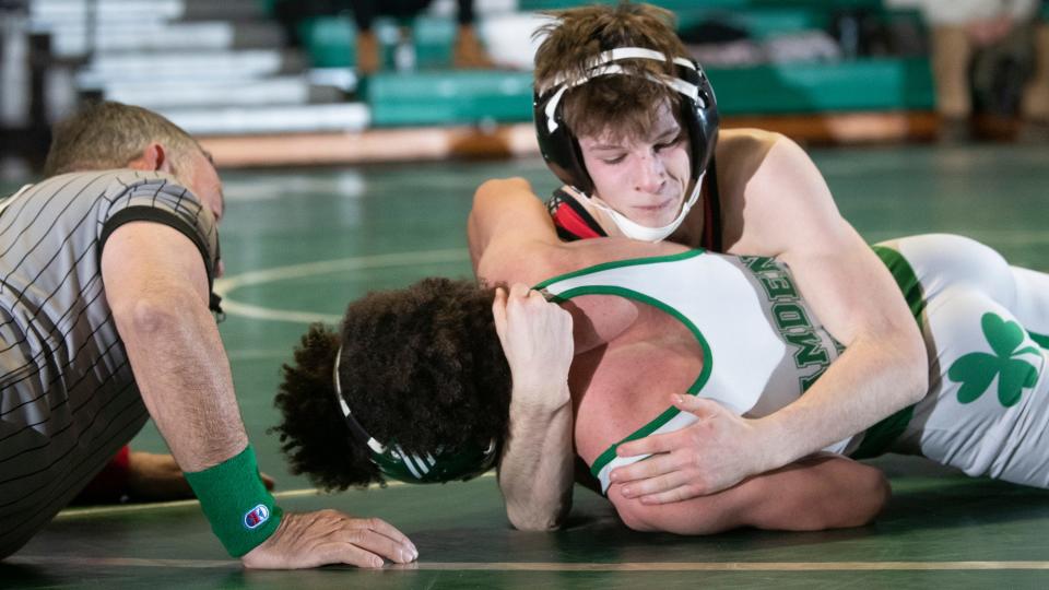 Kingsway's Nathan Lubonski, top, controls Camden Catholic's Miles Mason during the 126 lb. bout of the wrestling meet held at Camden Catholic High School in Cherry Hill on Friday, January 27, 2023.   Lubonski defeated Mason by pin.  