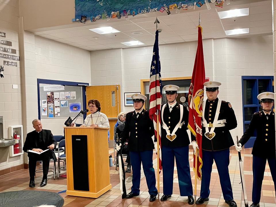 Tracy Williams, WHS Class of 1981 and trustee of the Alumni Association, spoke during a ceremony honoring the memories of Army Spc. Ryan McDermot and Marine Cpl. Jonathan Currier.