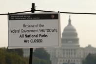 The U.S. Capitol looms in the background of a sign on the National Mall reminding visitors of the closures to all national parks due to the federal government shutdown in Washington October 3, 2013. The U.S. government shutdown prompted growing concern of wider economic consequences when it stretched into a third day on Thursday, and President Barack Obama challenged Republicans to "end this farce" by calling a straight vote on a spending bill. REUTERS/Kevin Lamarque (UNITED STATES - Tags: POLITICS BUSINESS HEALTH)