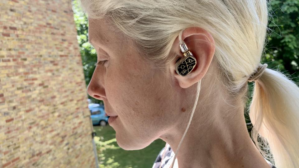 Campfire Audio Solaris Stellar Horizon worn by TechRadar's Becky Scarrott, on a balcony on a sunny day